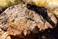 Petroglyph created by pounding and "pecking" at the flat rock